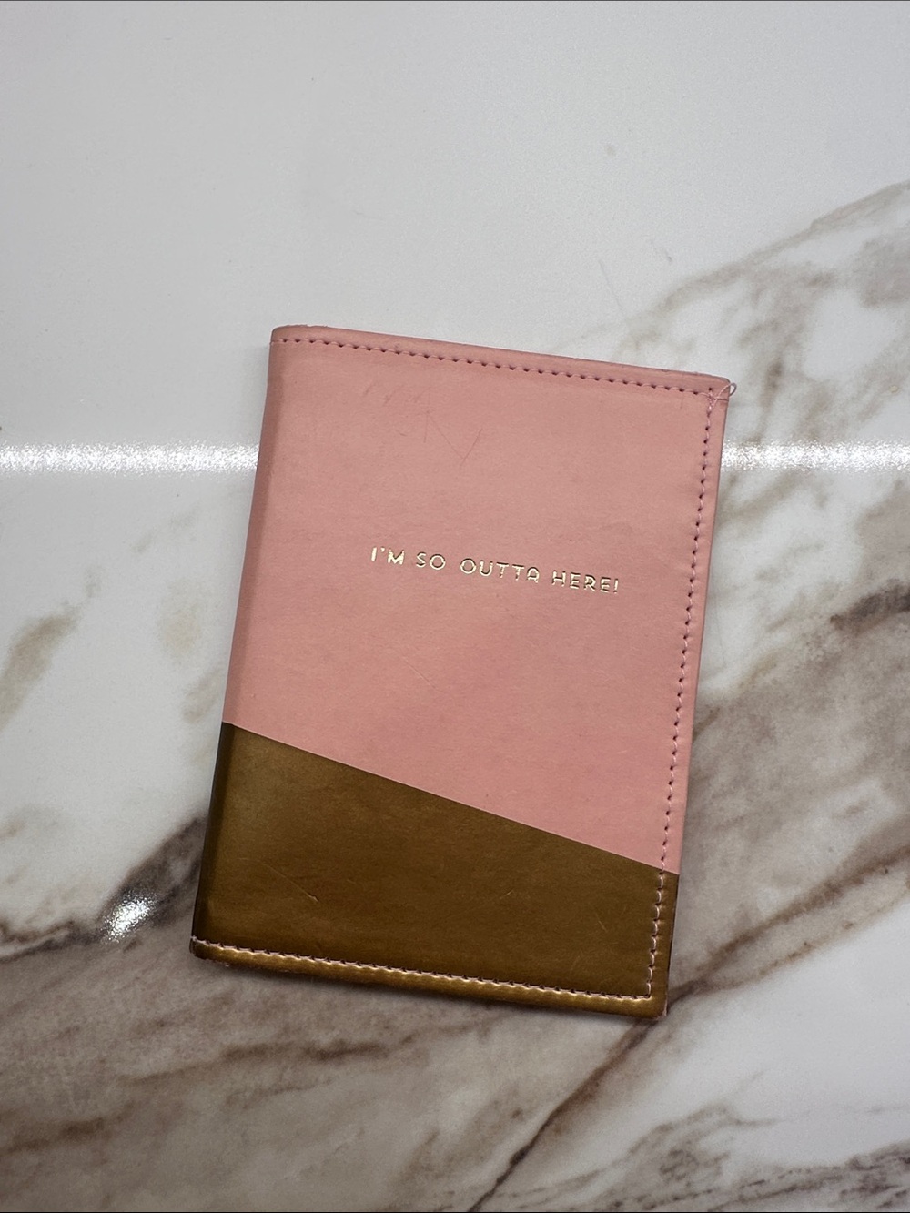 Pink and gold passport cover